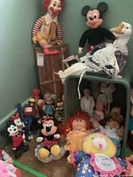 Full lot with multiple vintage promotional and character dolls including Ronald McDonald, Mickey and Minnie Mouse, piggy bank, and plush dolls.