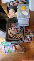 Photo of Rubbermaid tote filled with embroidery magazines, fabric, rings, and assorted supplies