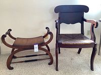 Photo showing the wooden armchair and curved wood bench side by side on carpeted floor, displaying overall shape and design.