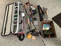 Overhead view showing rods, reels, cases and tackle bag