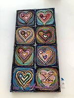 Front view of nine-heart textured painting on canvas