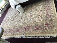 Wide shot showing full rug under bed, displaying overall pattern and size
