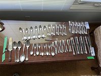 Overall layout of full flatware set arranged on tabletop