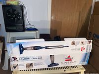 Full box of Bissell 3-in-1 vacuum showing the product and design on the packaging.