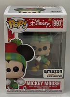 Front of box showing Disney Exclusive Christmas Mickey Mouse Funko Pop No. 997 with Amazon Exclusive sticker and clear window displaying figure.