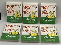 Six new hardcover copies of Dr. Seuss' 'Hop On Pop' arranged in two rows of three, showing the front covers clearly.
