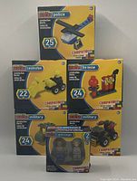 Photo of five boxed Make-It-Blocks construction block sets including police, construction, fire rescue, military, and pirate & knight themes.