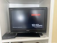 Sony Bravia flat screen television powered on, showing Verizon Fios TV screen.