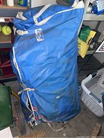 Blue Achilles storage bag packed with inflatable boat