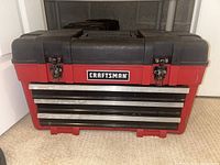 Closed Craftsman toolbox showing front with silver drawer handles and latches