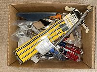 Overhead view of box with tools inside including General tubing bender packaging visible