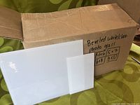 Box containing 4 frosted white bevelled glass panels of assorted sizes (4x6, 5x7, 6x8, 8x10) against a green background.