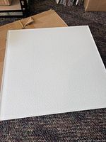 Single frosted glass textured tile 12x12 inches showing textured surface and white color.