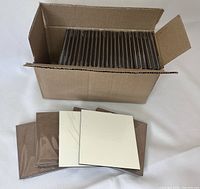 Box containing 60 individually wrapped white square MDF sublimation coasters, each 4x4 inches, with smooth front surface for printing.