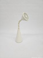 Front view of white Fryebo desk lamp with conical base and flexible goose neck stem against plain background.