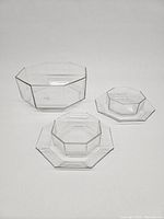 Full set of one large bowl, two smaller bowls, and two plates arranged to show size and shape differences