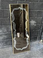 Full view of vintage rectangular mirror with gold tone frame and etched glass pattern on the reflective surface showing overall condition and detailing.