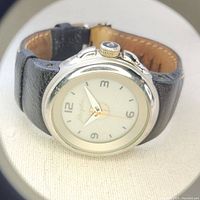 Front view of the Phosphor men's watch showing analogue dial and black leather strap.