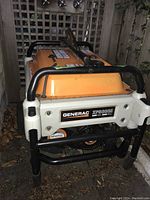 Front view of Generac XP8000E framed by black tubular bars