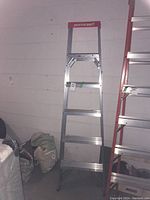 Front view of the MasterCraft aluminum ladder with six steps visible, showing overall condition and brand label.