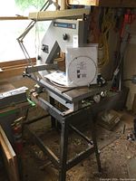 Front angle view of Beaver Model 16 bandsaw mounted on stand
