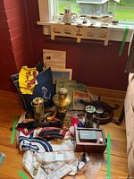 Overview of grouped nautical accessories on floor beneath window