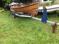 Starboard side view of boat on galvanized trailer