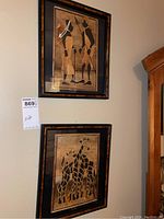 Two framed 8x11 African art pieces on wall; user tag '869' visible.