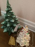 Overview of both ceramic Christmas trees side by side