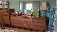 Front view of nine-drawer dresser with attached mirror