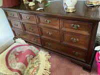 Full frontal view of solid wood Gibbard dresser showing the finish, style, and metal pulls on drawers.