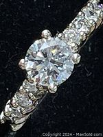 Front view showing center fancy light blue lab diamond and side accent diamonds