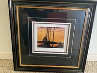 Front view of framed art print showing the entire piece including frame and matting.