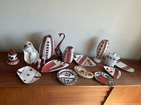 Wide view showing entire collection of Ukrainian ceramics on display including vases, figurines, plates, and dishes.