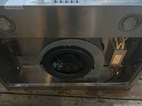 Photo of the interior exhaust fan and electrical components of the stove exhaust hood.