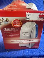 Photo of the humidifier box showing the product brand, name, features and branding details.