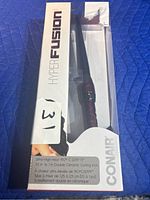 Box of Conair Hyperfusion hair curler showing front with product visible inside and text describing heat, barrel size, and ceramic features.