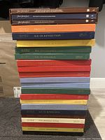 Stack of Time Life classical record books in various colors and titles representing different classical music periods.