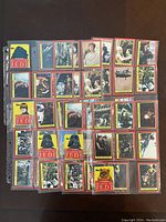 Photo showing approximately 30 Return of the Jedi Topps trading cards sleeved in a binder, featuring various characters and scenes.