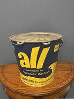 Front view of vintage All detergent container showing logo and text.
