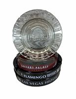 Close-up of Flamingo clear glass ashtray with pressed logo.