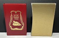 Red hardcover book titled 'Analysis of the Hunting Field' next to a gold slipcase