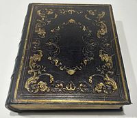 Front cover of the leather-bound 1861 Holy Bible with gold embossed decorative designs.