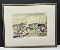 Framed watercolour depicting boats and harbor buildings with a stone wall in the foreground.