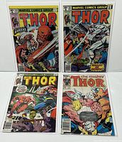 Four comic books from Marvel's The Mighty Thor series laid out showing covers. Colors vibrant and clear. Comics bagged and boarded.