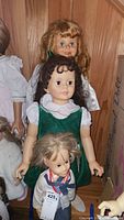 Front view of all three dolls together