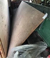 Two 5/8" wood core plywood sheets stacked, each measuring 4'x8'. The sheets show natural wood grain and mild surface marks.