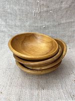 Stacked view of the four wooden bowls showing their size and shape.