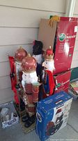 Photo showing several nutcracker statues and boxes including large nutcrackers and smaller ones.
