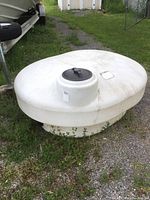 Front-side view showing dome top, black lid, and overall tank profile